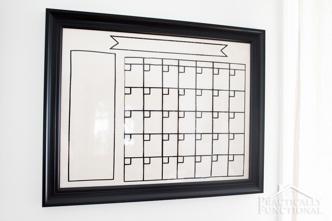 Make your own dry erase calendar with a glass picture frame and black adhesive vinyl!