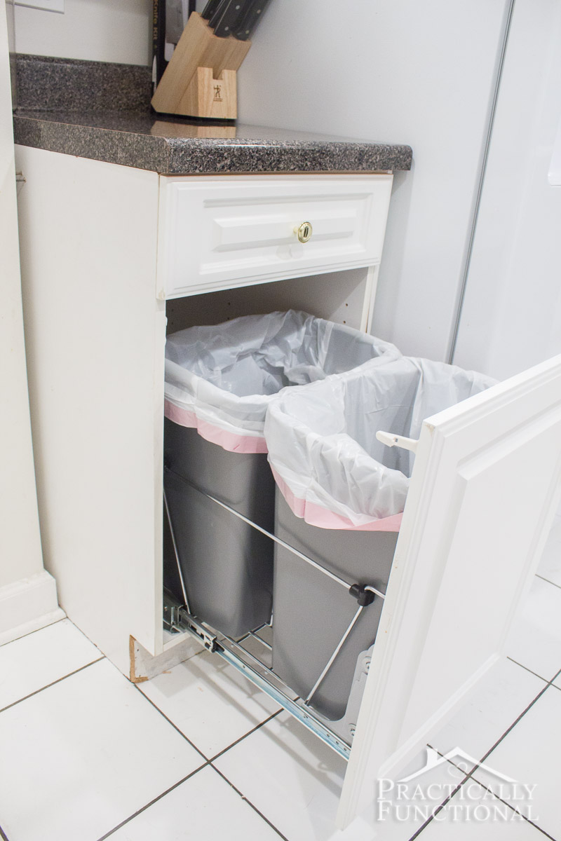 Turn an empty cabinet into DIY pull out trash cans in under an hour; so easy to do!